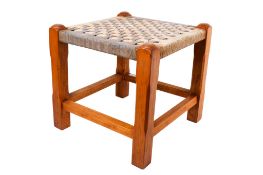 A mid-century stool. Having chamfered square supports.