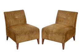 A pair of 20th century lounge chairs.