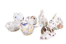 Seven Royal Crown Derby Collectors Guild animal paperweights.
