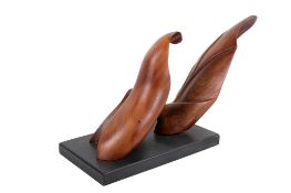 A contemporary semi-abstract carved wooden sculpture on a plinth, unsigned.