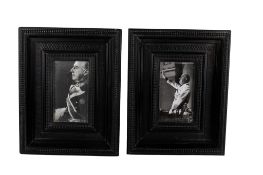 A pair of ornate ebonized picture frames.