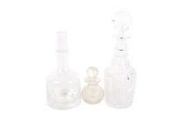 A 20th century Dartington glass decanter plus two others.