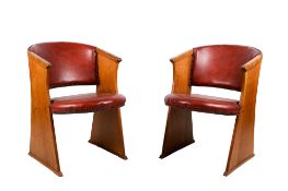 A pair of E Gomme New Cromwell style oak tub chairs. Having a St.