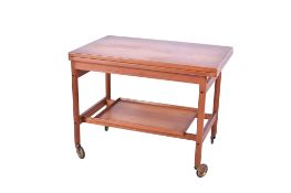 A mid-century teak fold over tea trolley.