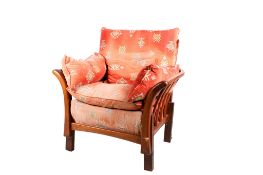 An adapted Ercol Renaissance open armchair. Having upholstered loose covers.