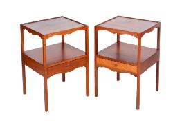 A pair of 20th century hardwood bedside tables/cabinets.