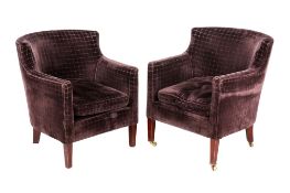 A pair of vintage tub chairs.