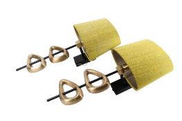 A pair of contemporary brass wall light sconces. Having asymmetric cast brass decoration.