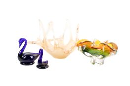 A group of four assorted glass items. Including two Bristol Blue swans, etc.