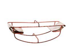 A mid-century young child's see-saw. Having a tubular metal frame and canvas seats.