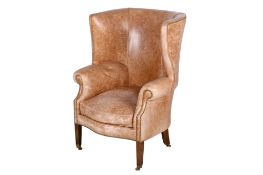 A 20th century wingback armchair.