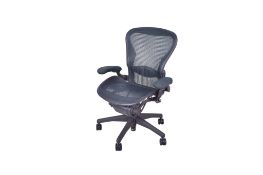 A Herman Miller contemporary adjustable office elbow chair. Having mesh back and seat.