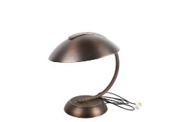 A contemporary Chelsom 'Hub Cap' table lamp. Raised on a circular base.