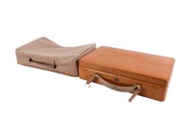 A vintage small brown leather case. Of rectangular form, having an outer cover, 20cm x 33cm, no key.