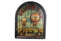 A reproduction painted wooden 'Balloon Race' sign.