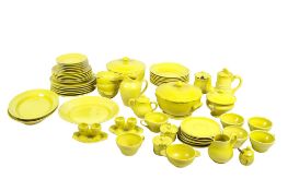 A collection of assorted Quimper HB yellow pottery dinner set pieces.