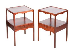 A pair of 20th century hardwood bedside tables/cabinets.