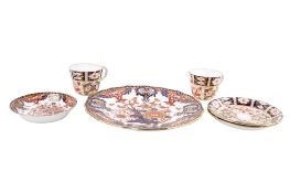 A group of six assorted Royal Crown Derby Imari items. Including a pair of teacups and saucers, etc.