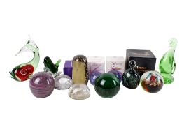 A group of assorted glass paperweights. Including Mdina and Caithness, some boxed.