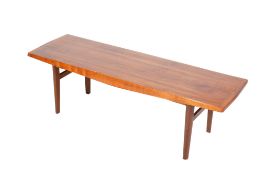 A mid-century teak coffee table in the style of Gordon Russell.
