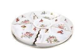 A Herend hand painted hors d'oeuvres serving dish. Having six sections on a stand.