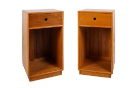 A pair of circa 2012 John M. Haynes pine bedside cabinets.