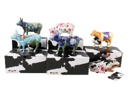 A collection of assorted Cow Parade novelty ceramic cow figures. Some boxed.