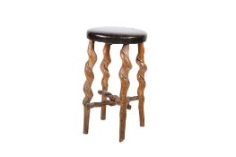 A vintage natural twist leg wooden stool with brown leather seat.