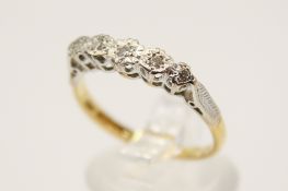 An 18ct gold and five stone diamond ring.