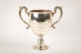 An early 20th century twin-handled silver trophy.