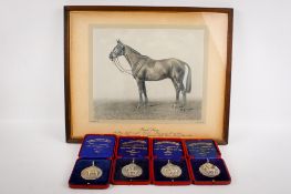 Four 1930s boxed silver medallions and accompanying framed photograph of a racehorse.