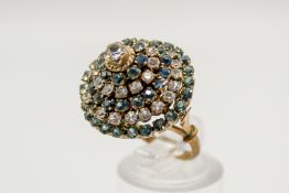 An Indian style yellow metal and sapphire dress ring.