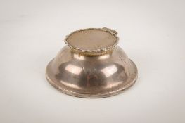 An early 20th century weighted silver inkwell.