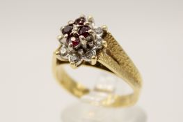 An 18ct gold cluster ring.