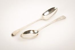 A pair of Georgian silver serving spoons.