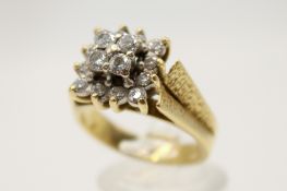 An 18ct gold and diamond cluster ring.