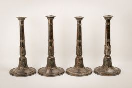 A set of four early 19th century French silver candlesticks.
