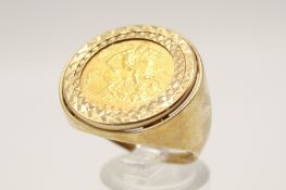 A 1982 half sovereign coin in a 9ct gold ring. Hallmarked, total diameter of ring head 2.