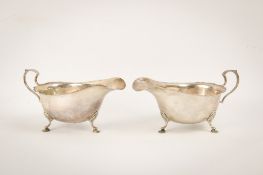 A pair of silver sauce boats.