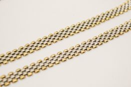 A 9ct gold bicolour matching necklace and bracelet. Four rows of brick set panels, total width 0.