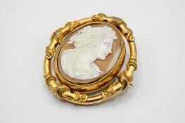 A Victorian gold plated swivel cameo brooch.