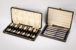 Two boxed sets of silver cutlery.