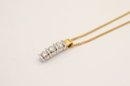 An 18ct gold and diamond pendant. Set with three round brilliant cut diamonds of 0.