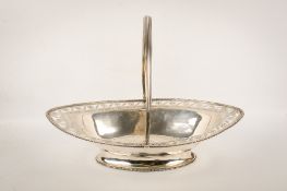 A large white metal swing handled dish.