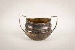 A George V silver twin handled sugar bowl.