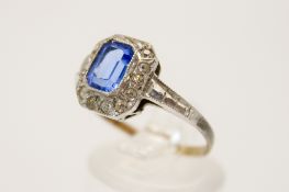 A blue (possibly synthetic spinel) and colourless stone ring.