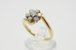 An 18ct gold and diamond cluster ring.