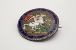 A George III silver 1820 enamelled crown coin brooch.