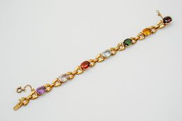 A yellow metal stone set bracelet.