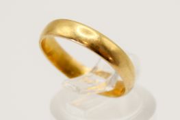 A 22ct gold wedding ring. Hallmarked, width of band 4mm, size N, weight 3.3g.